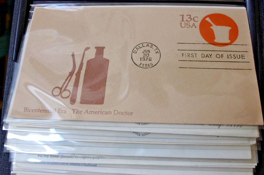 Professional album with 100, 1st Day of Issue and Other Commemorative Covers.15